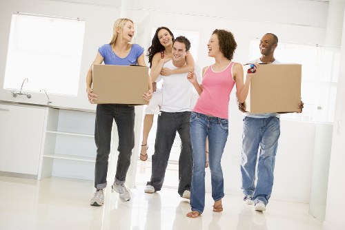 Worker moving boxes in a professional removal setting