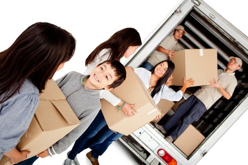 Flat removal move in Hammersmith with packed boxes and moving van