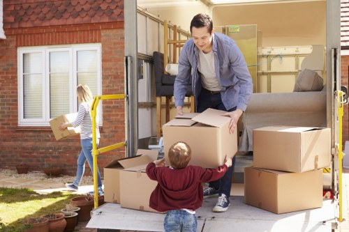 Business movers transporting office furniture during a Hammersmith commercial move