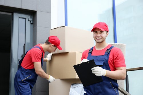 Movers handling packed boxes during transport