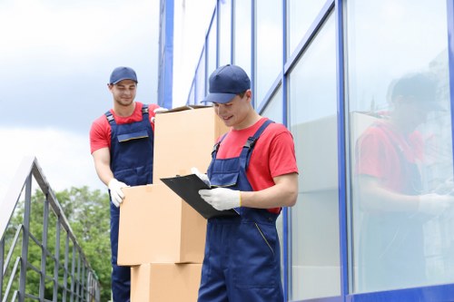 Office relocation planning in Hammersmith with moving boxes and workspace setup