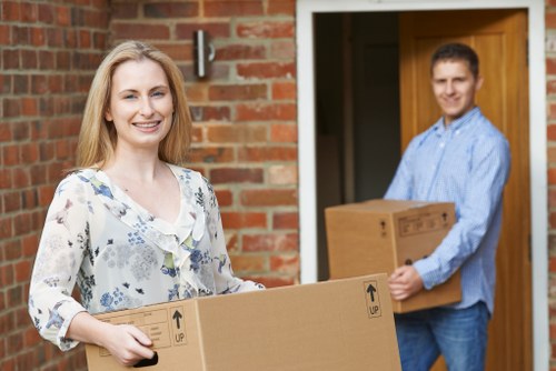 Professional movers handling boxes and furniture