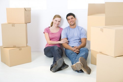 Professional movers packing boxes for a relocation in Hammersmith