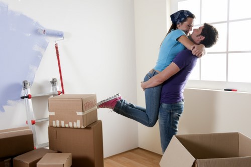 Removal team using safe lifting and protective equipment during a move
