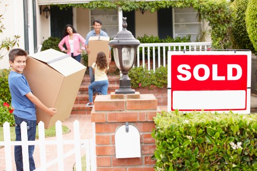 Professional movers handling flat removals in Hammersmith on a city street