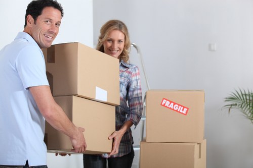Professional movers organizing items for transport in Hammersmith