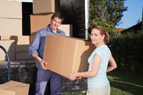 Professional office movers handling furniture and equipment for a Hammersmith business