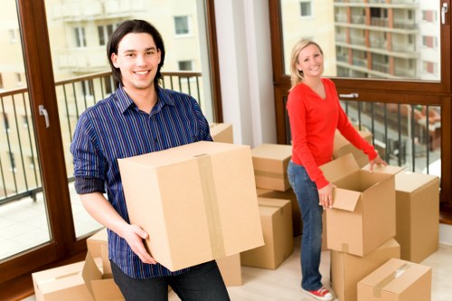 Movers using protective equipment for a safe house removal in Hammersmith